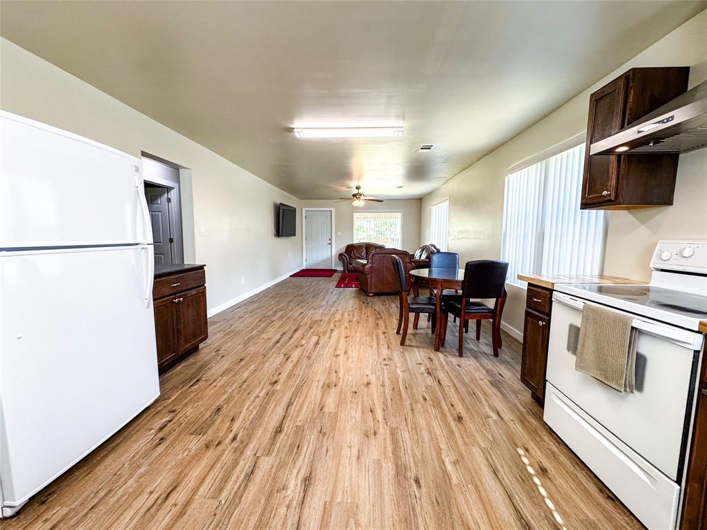 505 Main Street Rochester, TX 79544 - Photo 11 of 24 a living room with stainless steel appliances furniture and a flat screen tv