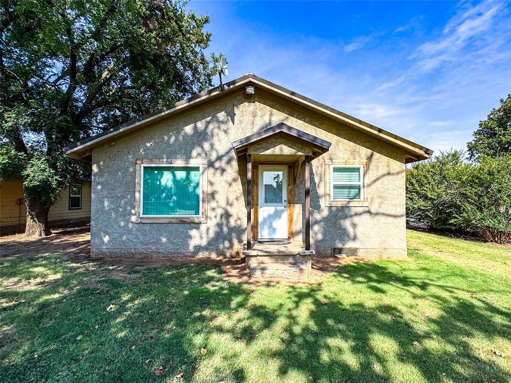 505 Main Street Rochester, TX 79544 - Photo 22 of 24 a front view of a house with a yard