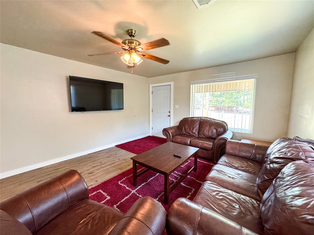 505 Main Street Rochester, TX 79544 - Photo 5 of 24 a living room with furniture and a flat screen tv