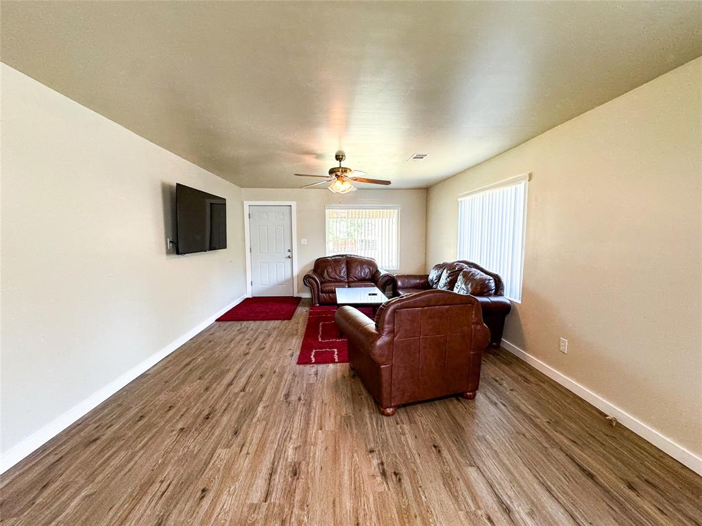 505 Main Street Rochester, TX 79544 - Photo 7 of 24 a living room with furniture and a flat screen tv