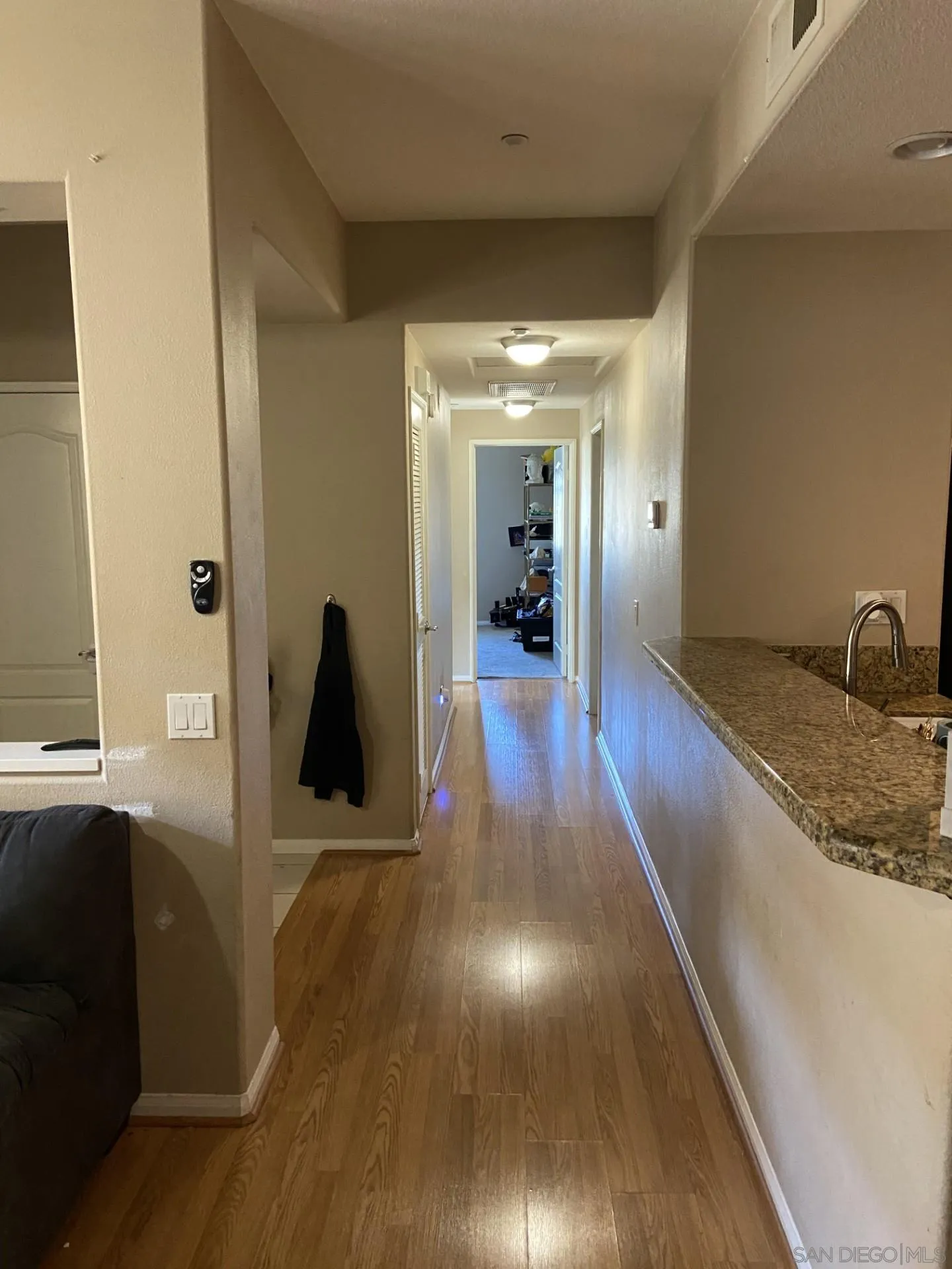 64 Via Sovana Santee, CA 92071 - Photo 7 of 15 a view of a hallway with wooden floor