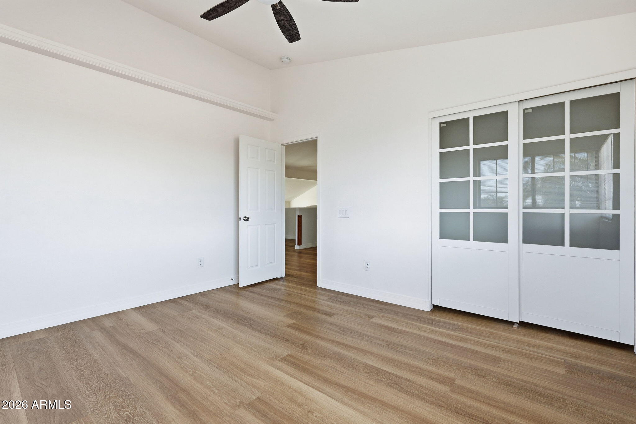 742 North Boulder Street Gilbert, AZ 85234 - Photo 13 of 22 an empty room with wooden floor and windows