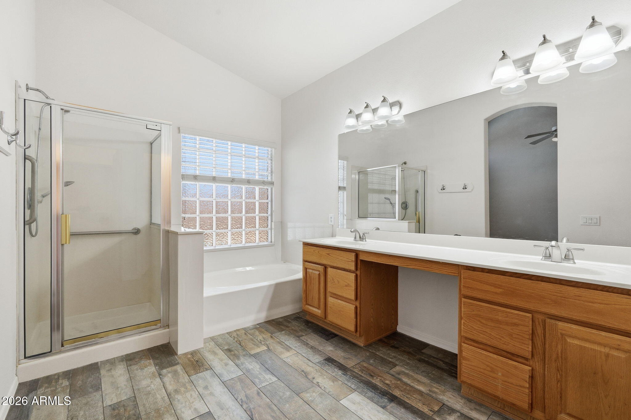 742 North Boulder Street Gilbert, AZ 85234 - Photo 16 of 22 a spacious bathroom with a double vanity sink a mirror and a bathtub