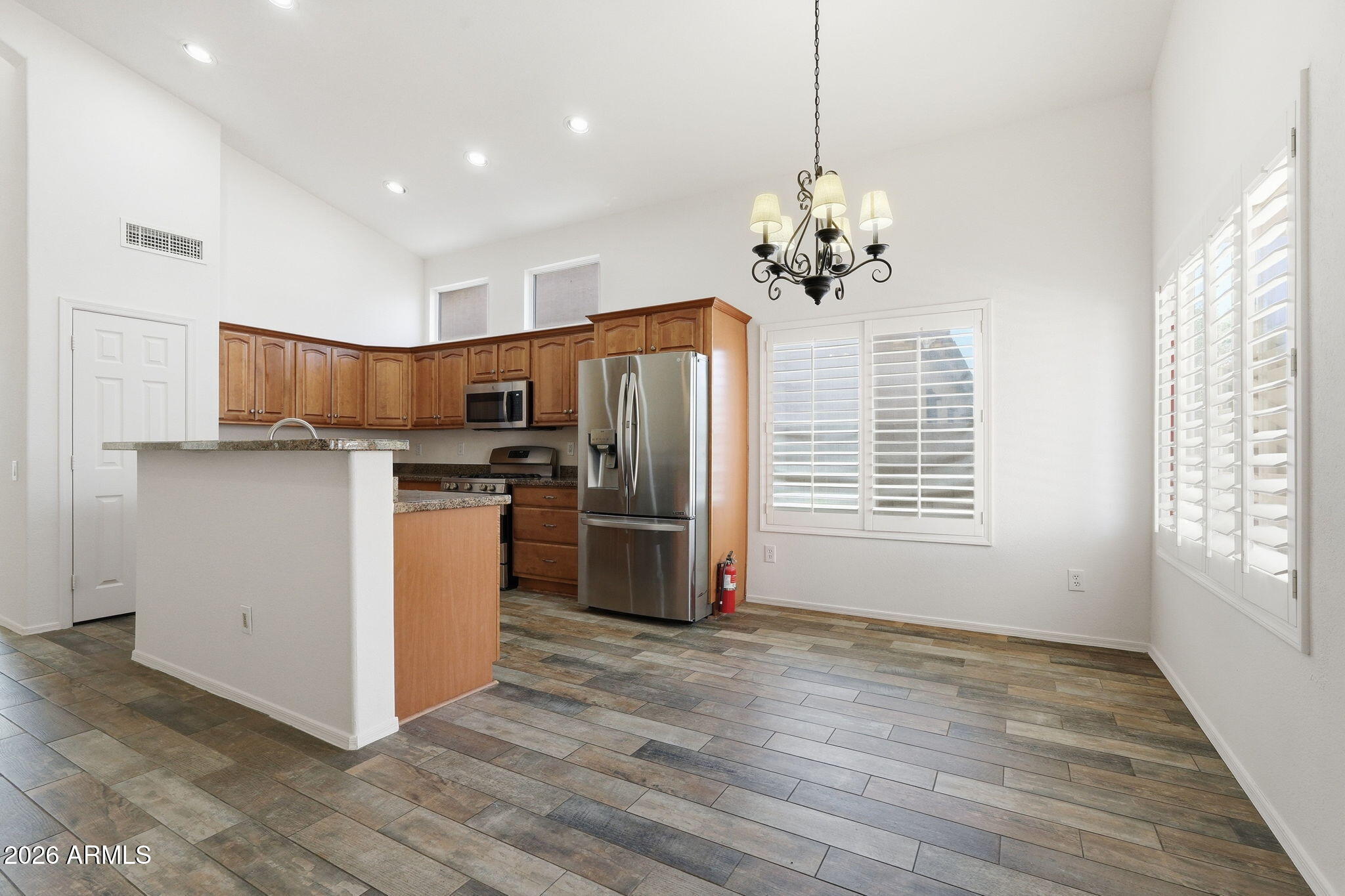 742 North Boulder Street Gilbert, AZ 85234 - Photo 17 of 22 a view of kitchen with refrigerator microwave and oven