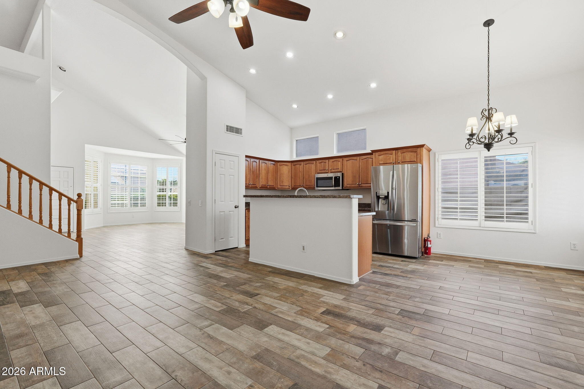 742 North Boulder Street Gilbert, AZ 85234 - Photo 18 of 22 a view of a kitchen with refrigerator and wooden floor