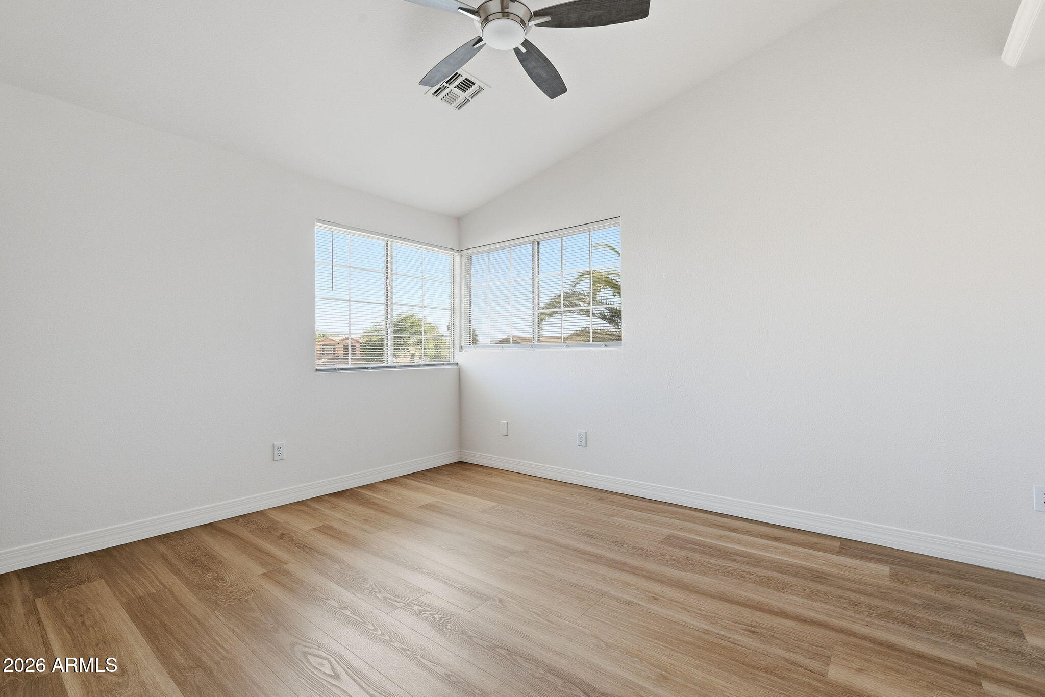 742 North Boulder Street Gilbert, AZ 85234 - Photo 7 of 22 a view of empty room with wooden floor and fan