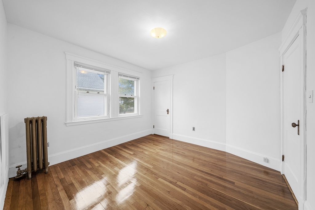 180 Faneuil Street, Unit 2 Boston, MA 02135 - Photo 19 of 37 an empty room with windows