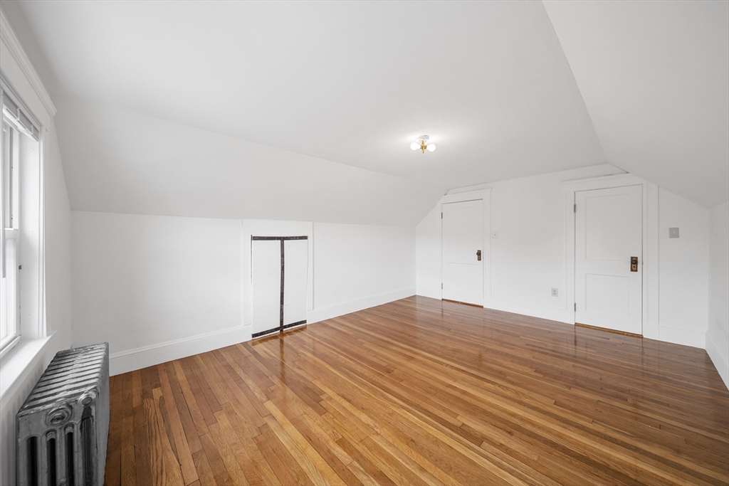 180 Faneuil Street, Unit 2 Boston, MA 02135 - Photo 23 of 37 a view of a room with wooden floor