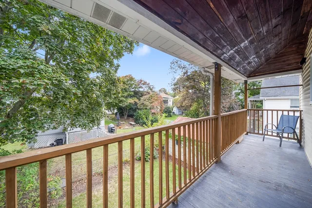 a view of balcony with wooden floor
