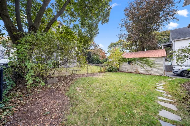 a backyard of a house with lots of green space