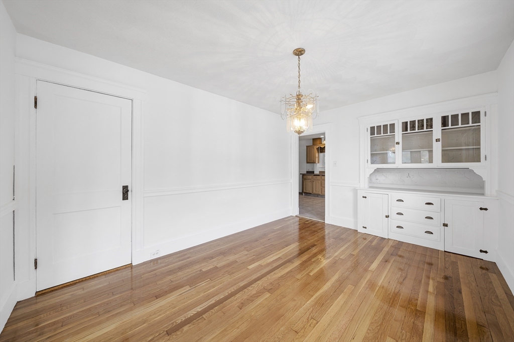 180 Faneuil Street, Unit 2 Boston, MA 02135 - Photo 6 of 37 a view of empty room with wooden floor