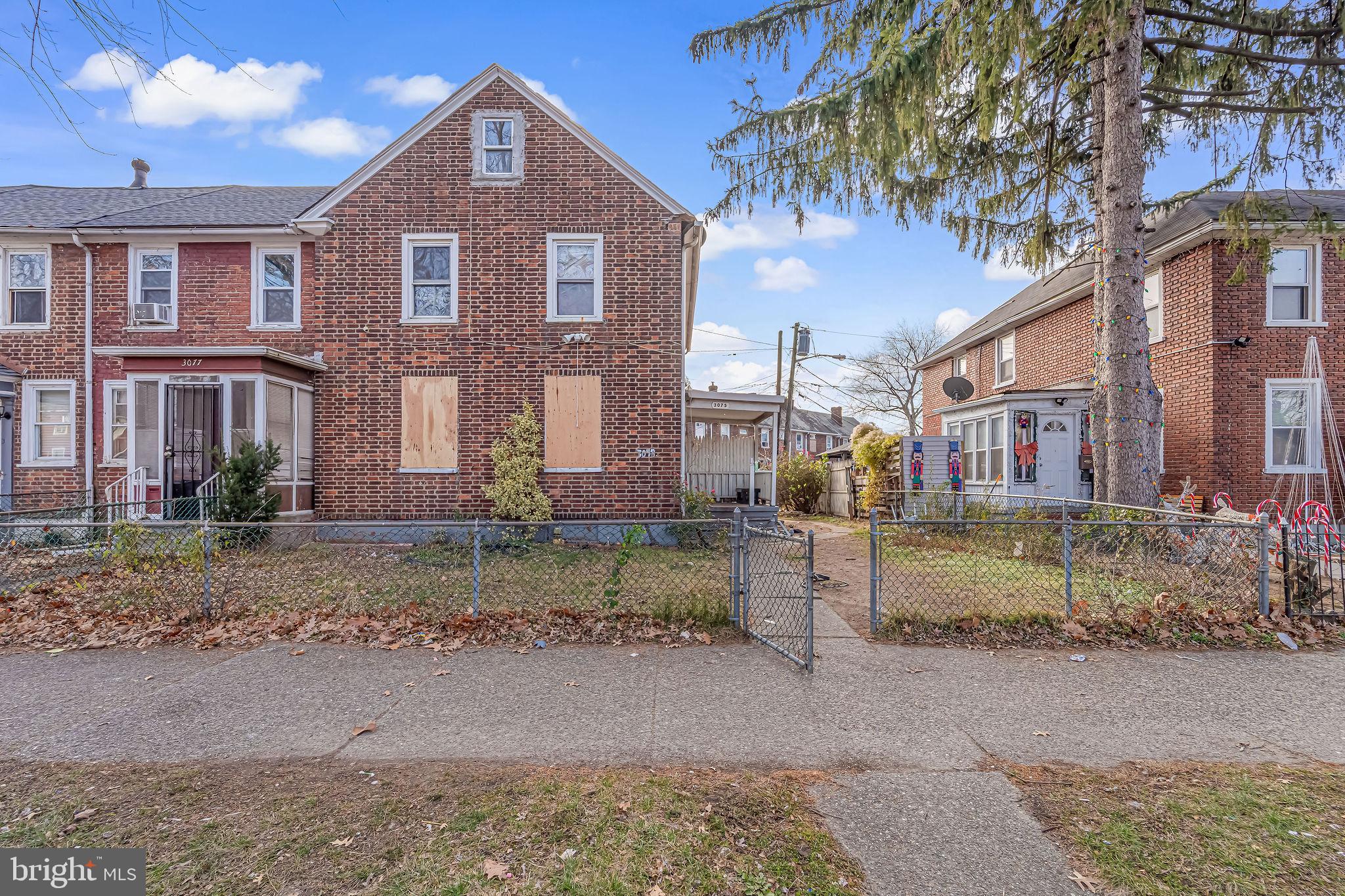 3075 Alabama Road Camden, NJ 08104 - Photo 1 of 1 a front view of a house with a yard