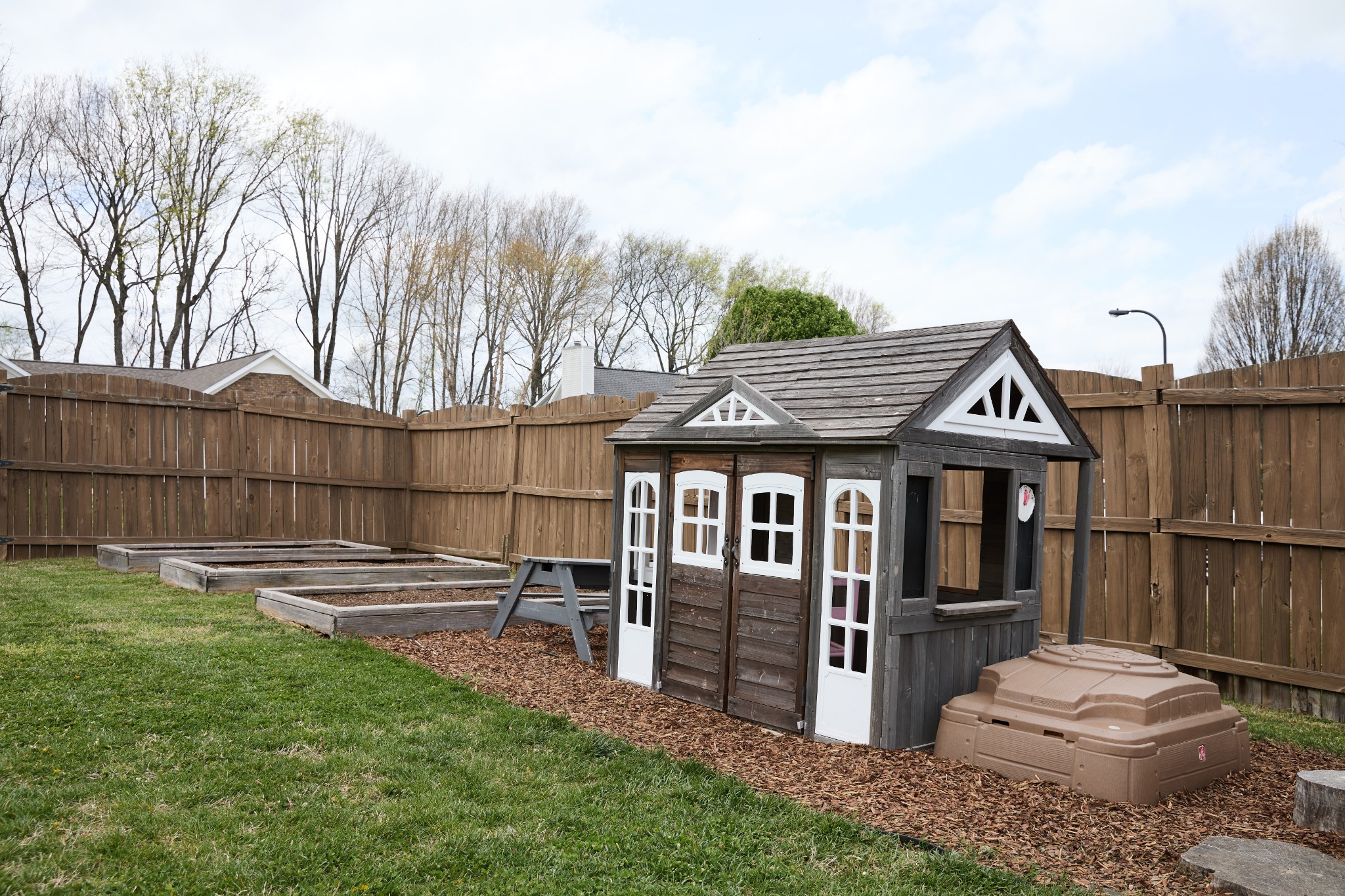 1910 Portview Drive Spring Hill, TN 37174 - Photo 44 of 50 a view of a patio with table and chairs and wooden fence