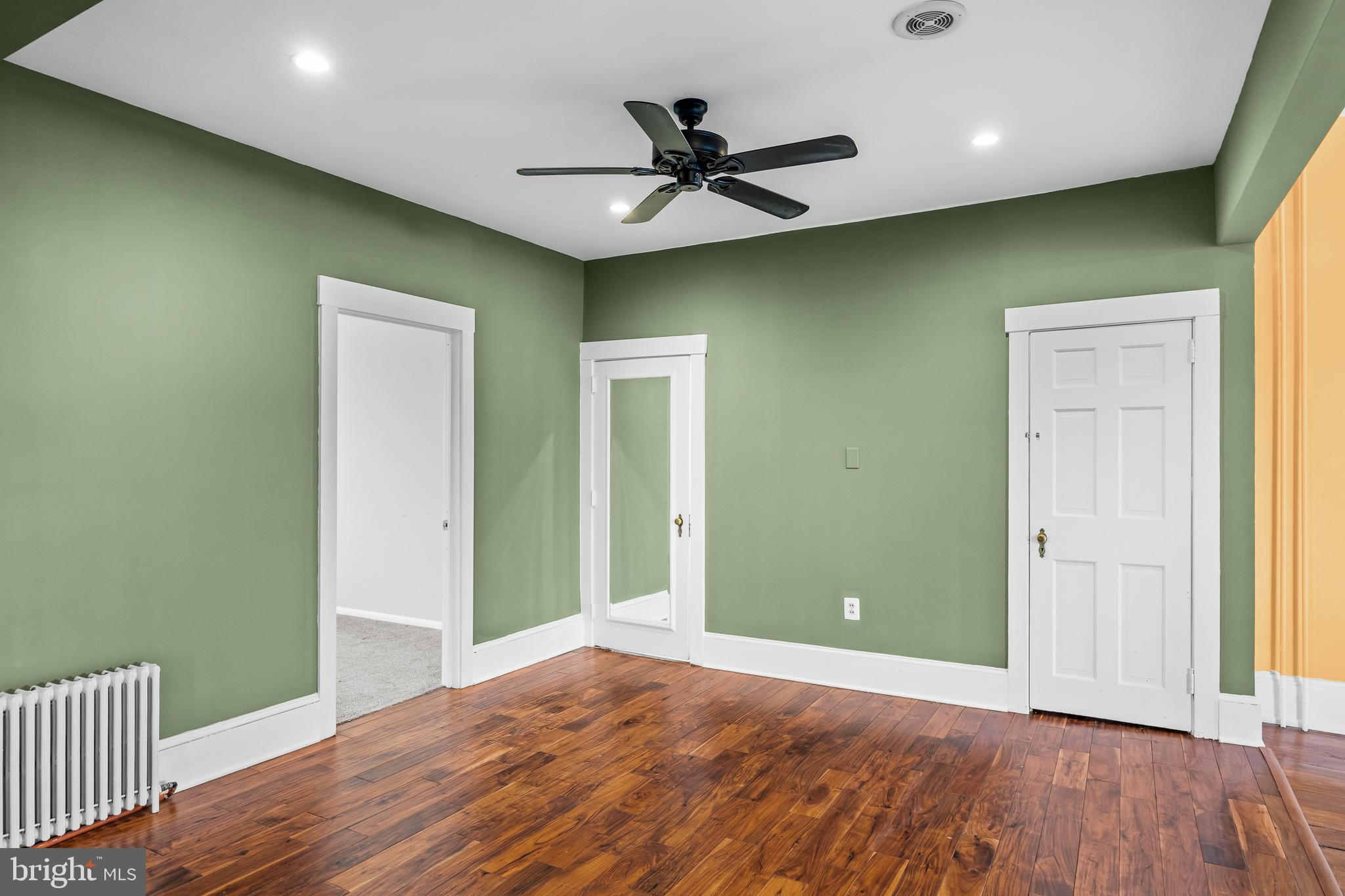 53 Arneys Mt Road Pemberton, NJ 08068 - Photo 21 of 61 an empty room with wooden floor and a ceiling fan