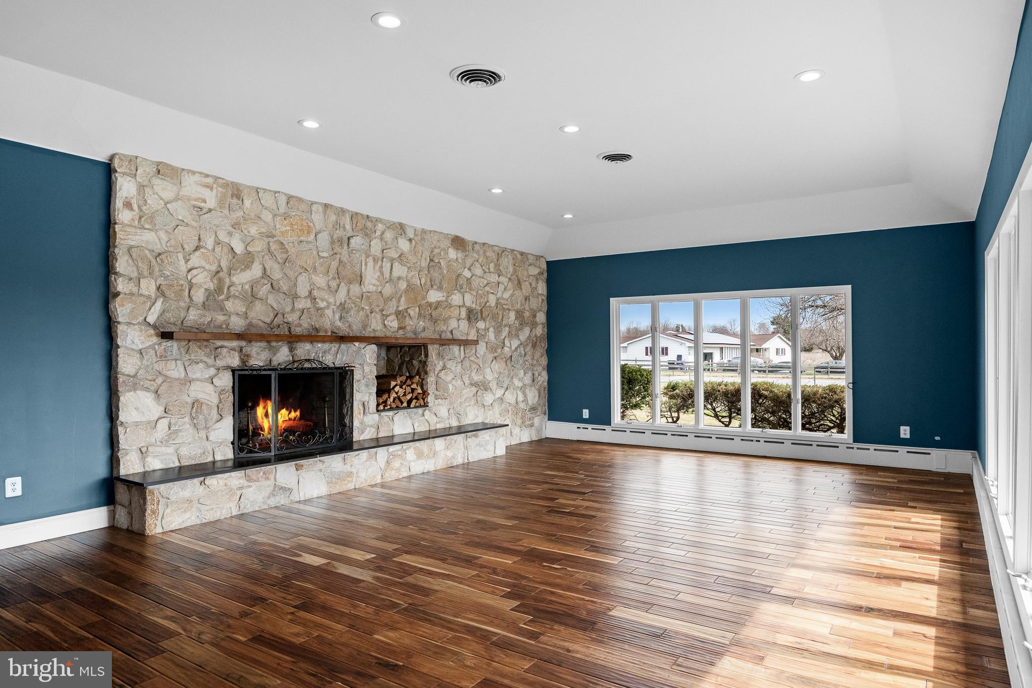 53 Arneys Mt Road Pemberton, NJ 08068 - Photo 9 of 61 a view of an empty room with wooden floor and a fireplace
