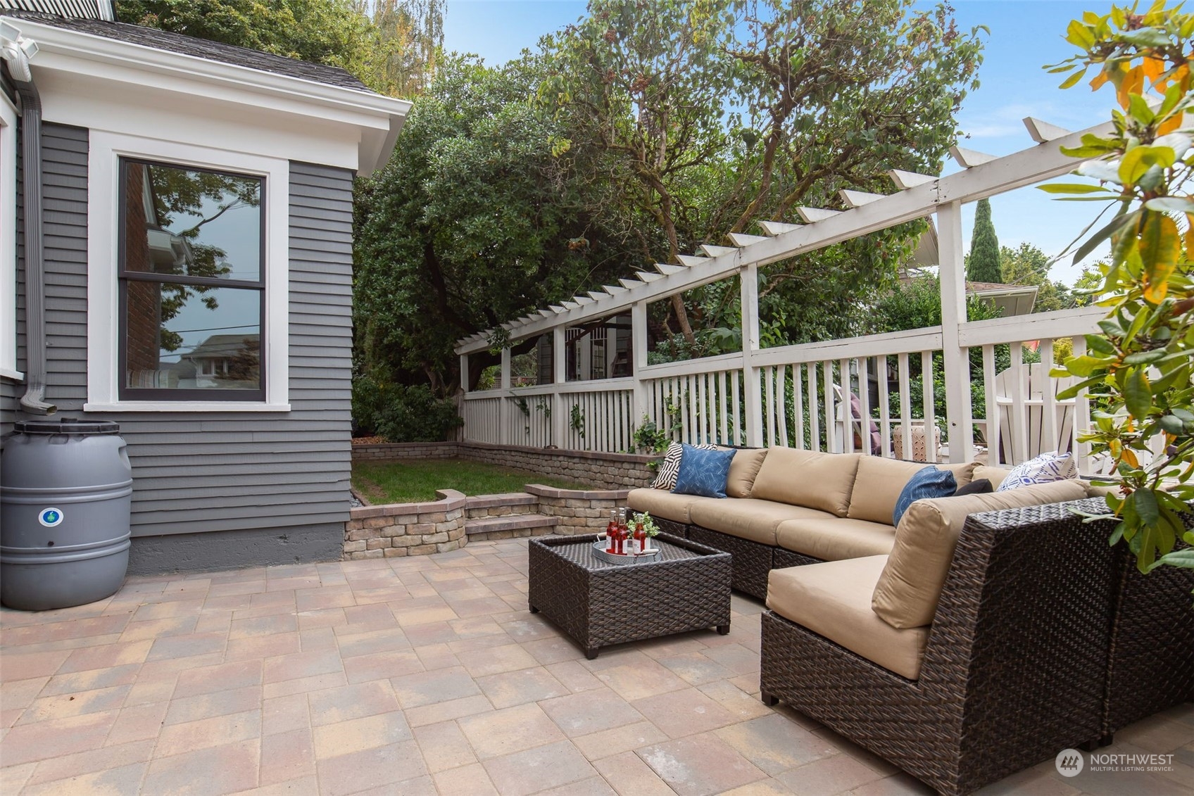3130 Broadway East Seattle, WA 98102 - Photo 17 of 32 a view of a patio with couches chairs and wooden floor