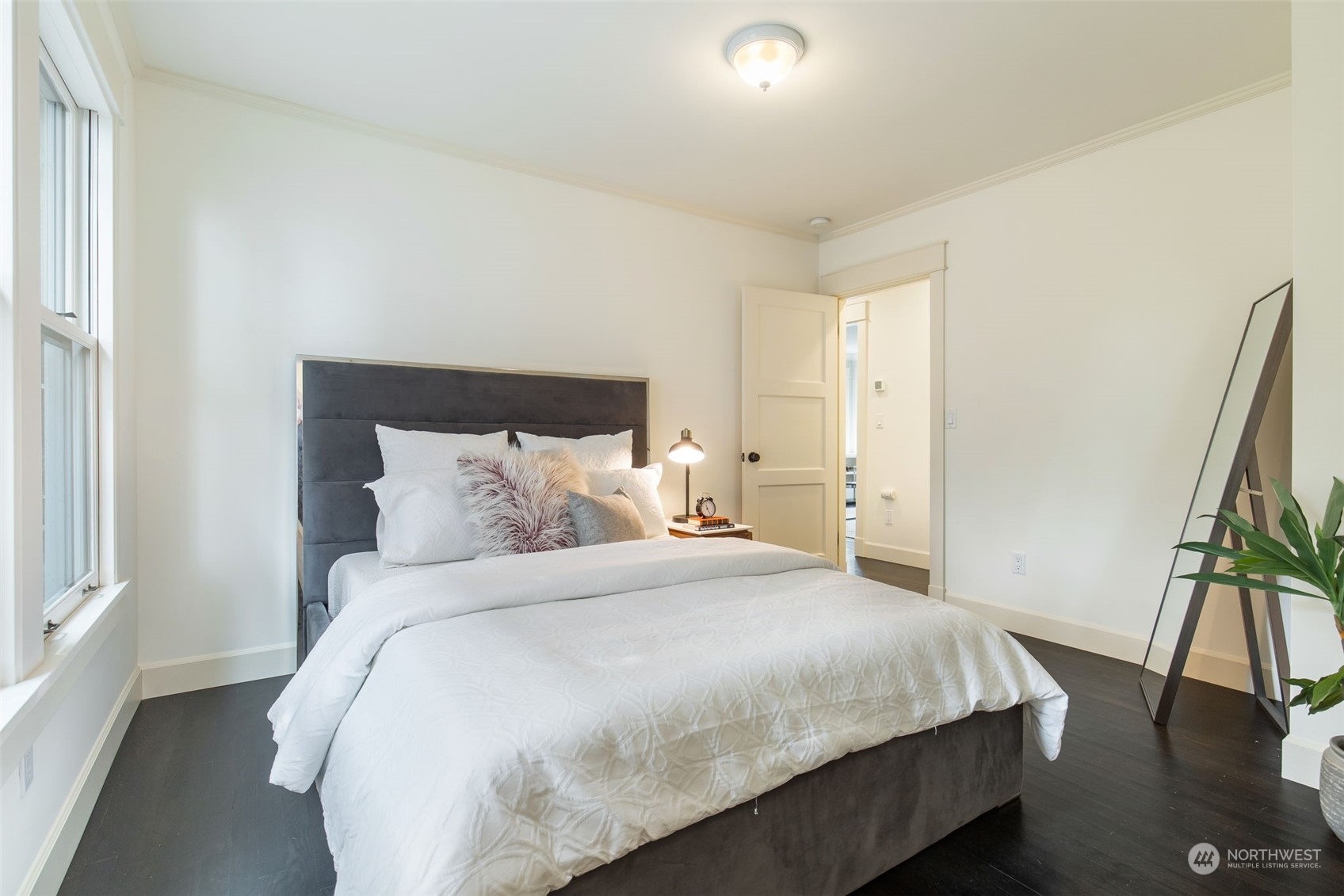 3130 Broadway East Seattle, WA 98102 - Photo 23 of 32 a bedroom with a bed and a flat screen tv