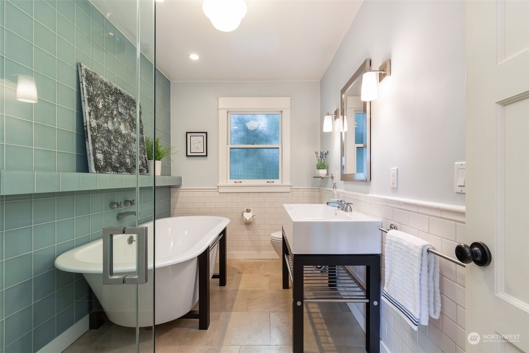 3130 Broadway East Seattle, WA 98102 - Photo 25 of 32 a bathroom with a sink and a mirror