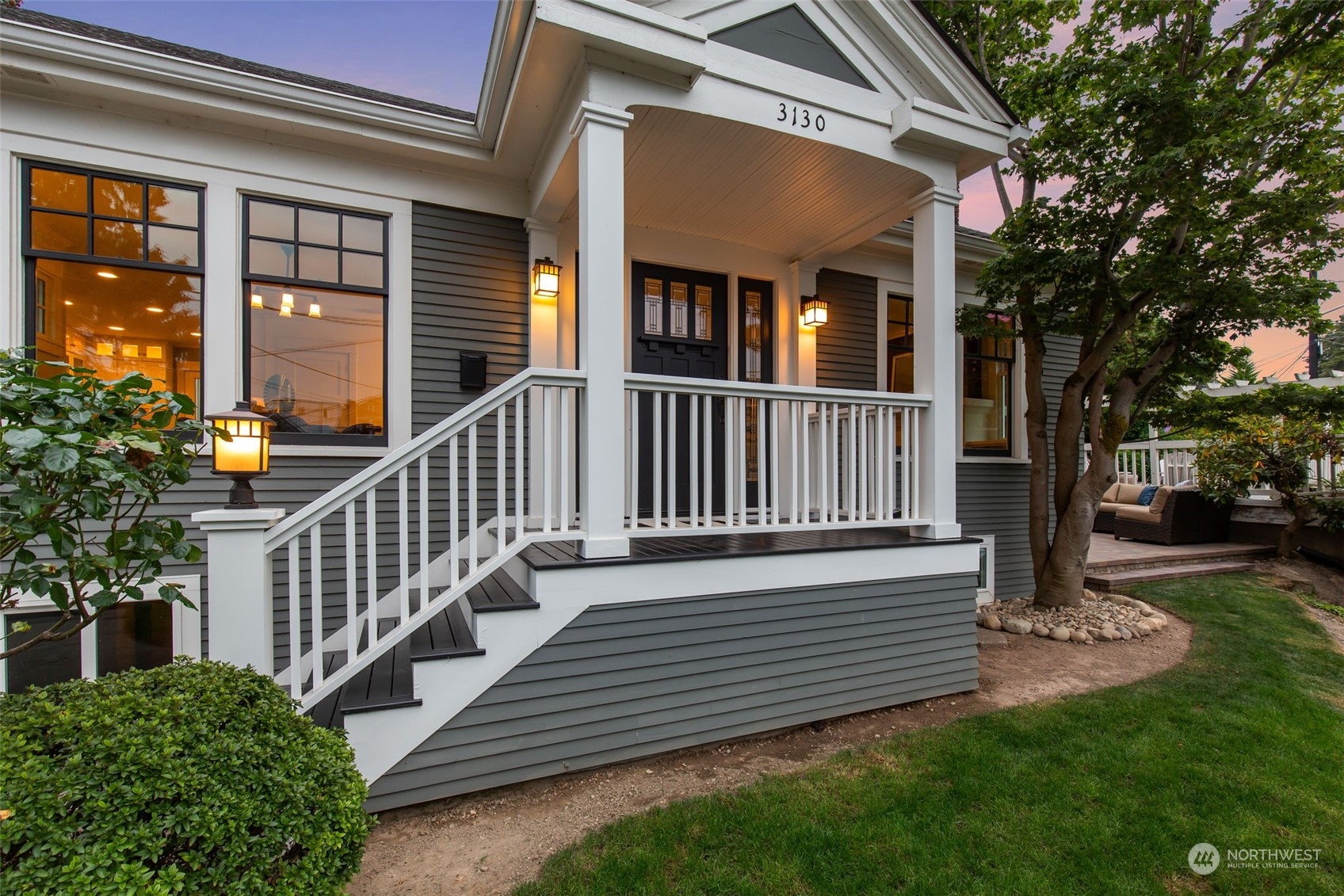 3130 Broadway East Seattle, WA 98102 - Photo 4 of 32 a view of a house with a small yard and wooden floor and fence