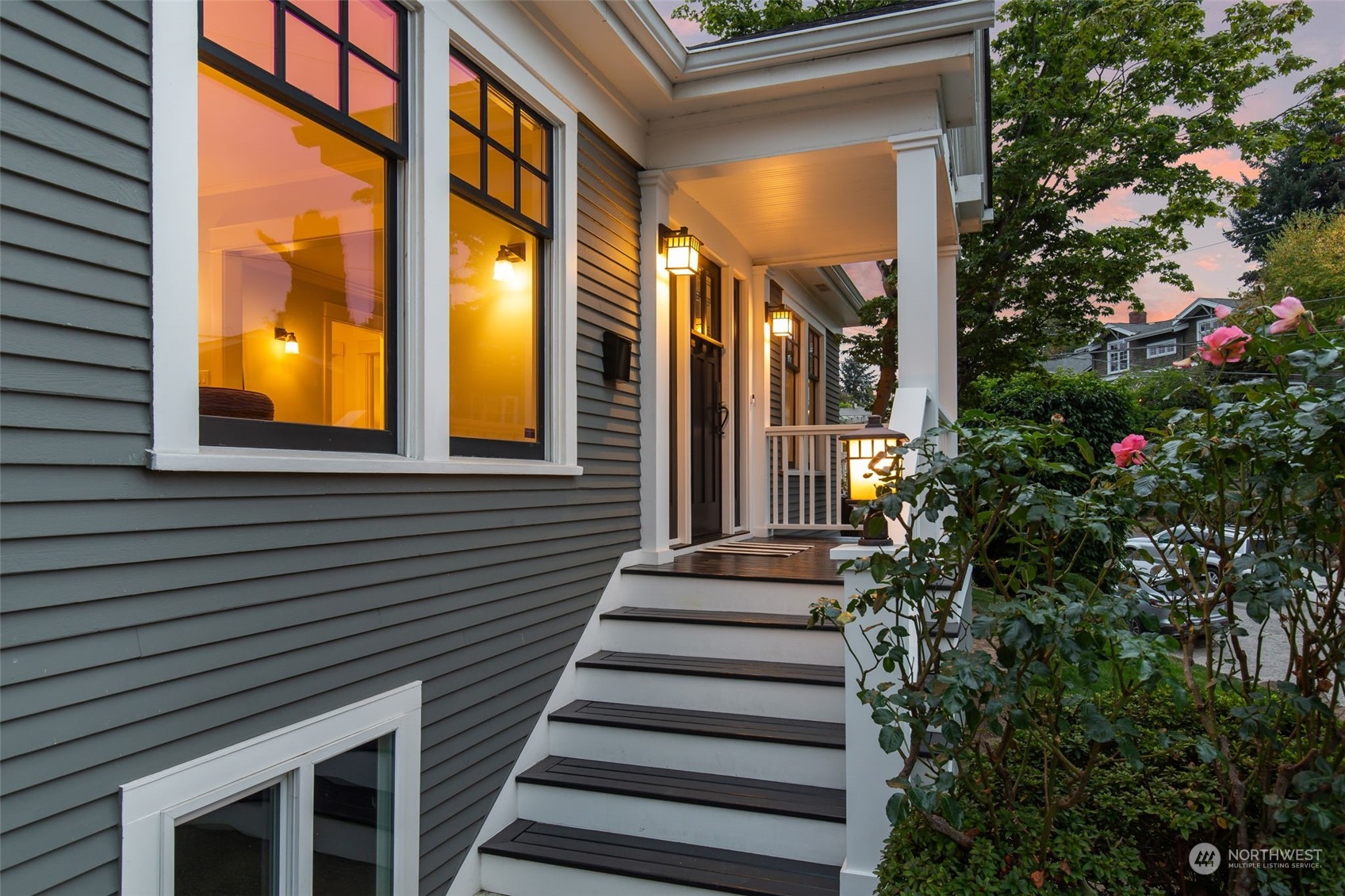 3130 Broadway East Seattle, WA 98102 - Photo 5 of 32 a view of a house with a windows and flower plants