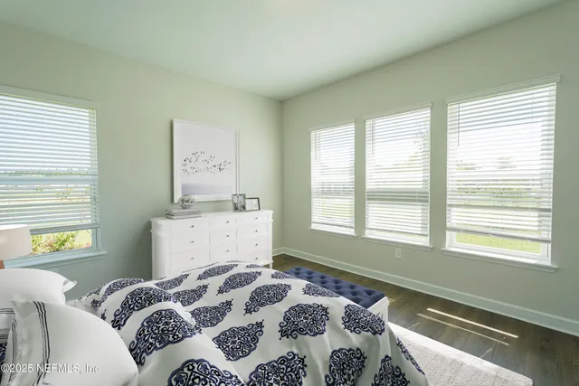 a large kitchen with kitchen island a large counter top space appliances and cabinets