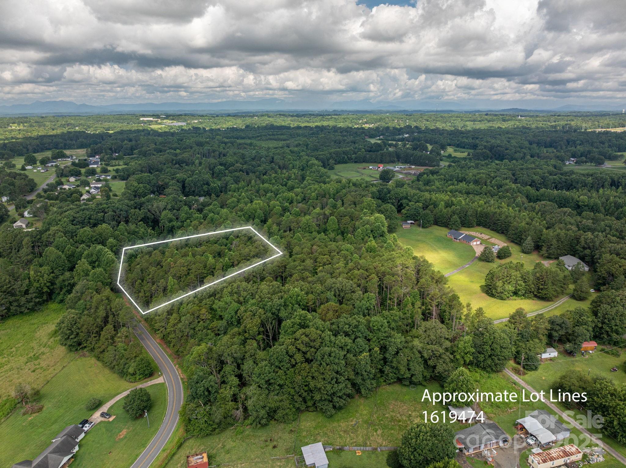Lot 10 McDade Road Forest City, NC 28043 - Photo 3 of 11 an aerial view of residential houses with outdoor space and trees