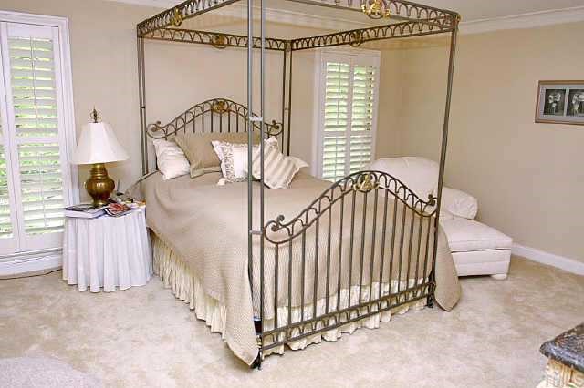2011 Landings Way Raleigh, NC 27615 - Photo 7 of 10 a bedroom with a bed and a chandelier