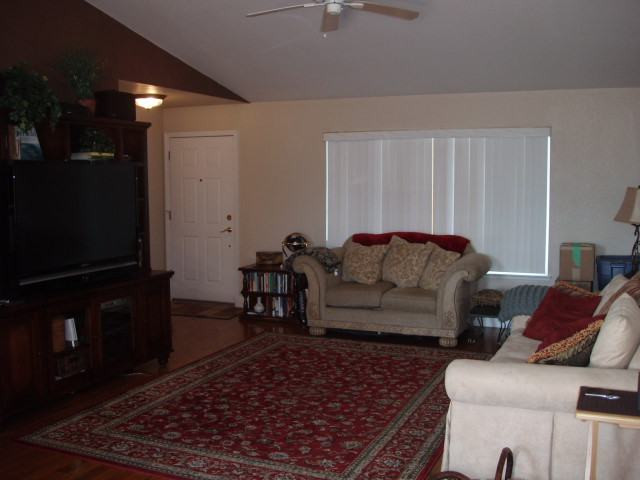 1930 Summer Star Road Reno, NV 89511 - Photo 3 of 9 a living room with furniture and a rug
