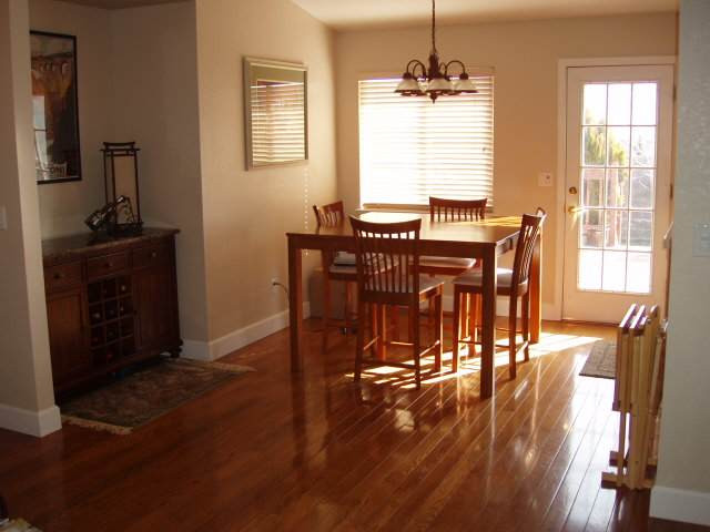 1930 Summer Star Road Reno, NV 89511 - Photo 4 of 9 a view of a dining room with furniture window and wooden floor