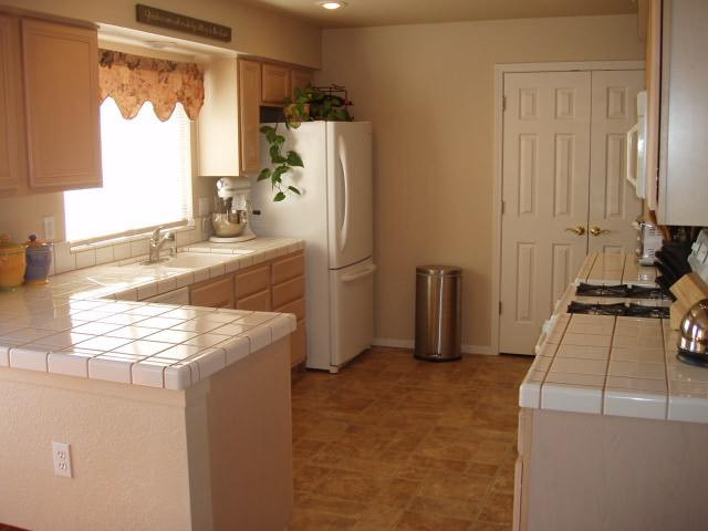 1930 Summer Star Road Reno, NV 89511 - Photo 5 of 9 a kitchen with refrigerator and window