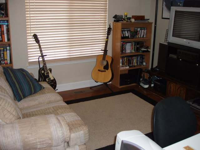 1930 Summer Star Road Reno, NV 89511 - Photo 6 of 9 a bedroom with a bed a book shelf and a window