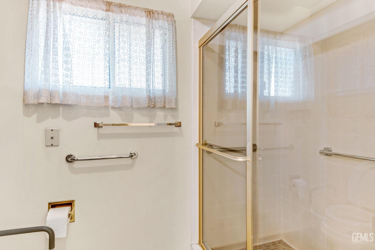 Undisclosed Address Bakersfield, CA 93309 - Photo 12 of 46 a bathroom with a shower and a sink