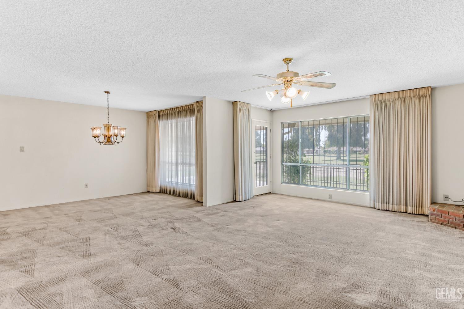 Undisclosed Address Bakersfield, CA 93309 - Photo 18 of 46 a view of an empty room with a window