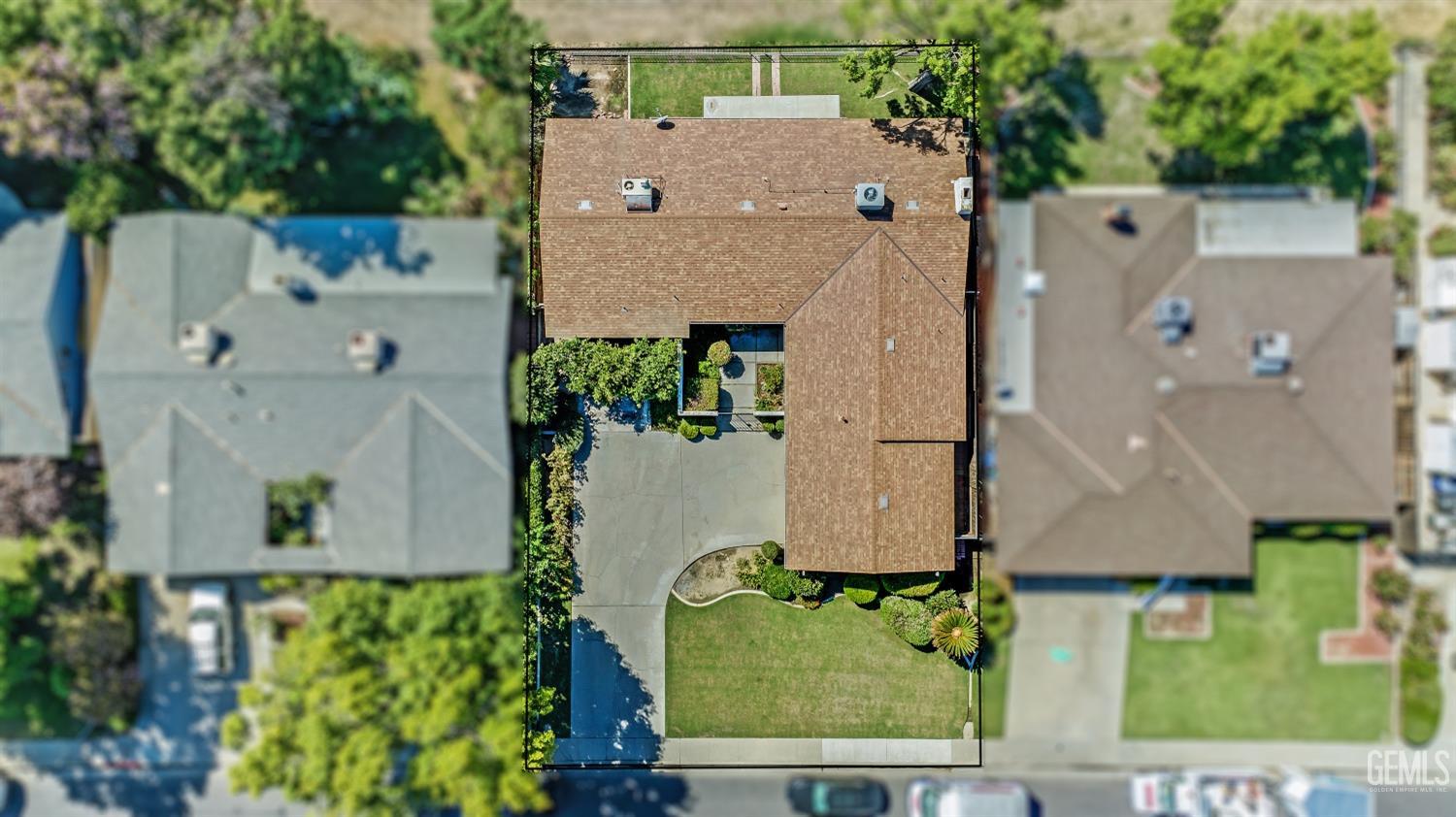 Undisclosed Address Bakersfield, CA 93309 - Photo 2 of 46 an aerial view of a house with a yard