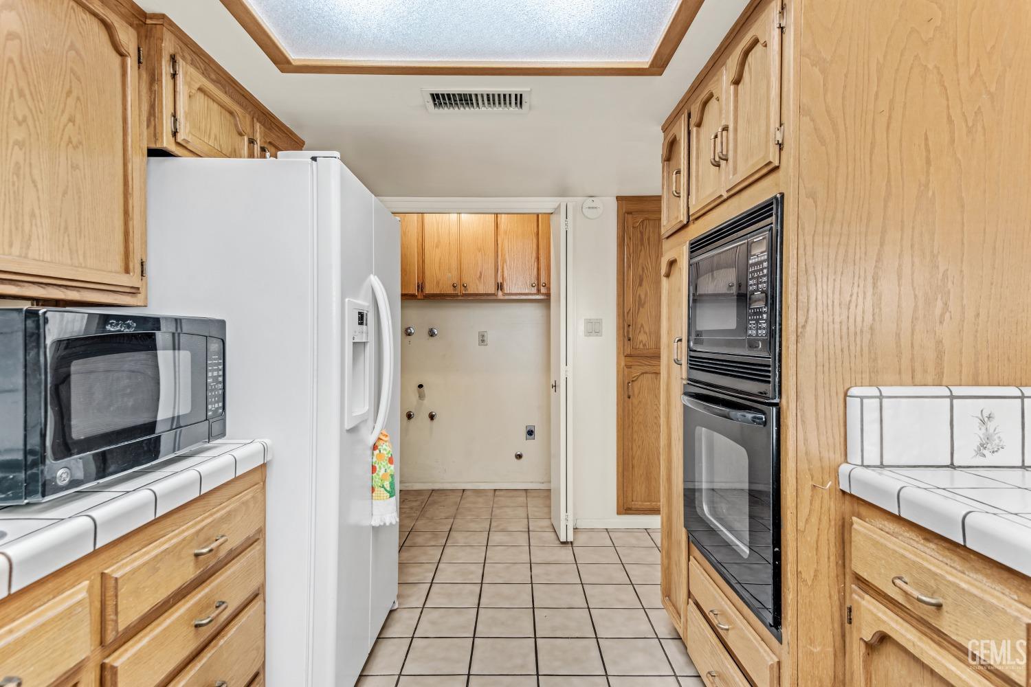 Undisclosed Address Bakersfield, CA 93309 - Photo 22 of 46 a kitchen with stainless steel appliances a refrigerator and a stove top oven