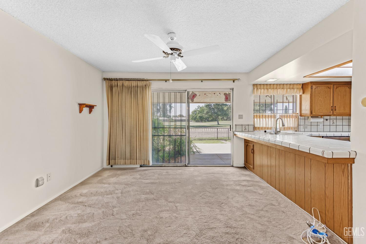 Undisclosed Address Bakersfield, CA 93309 - Photo 24 of 46 a large kitchen with kitchen island granite countertop a large window and a sink