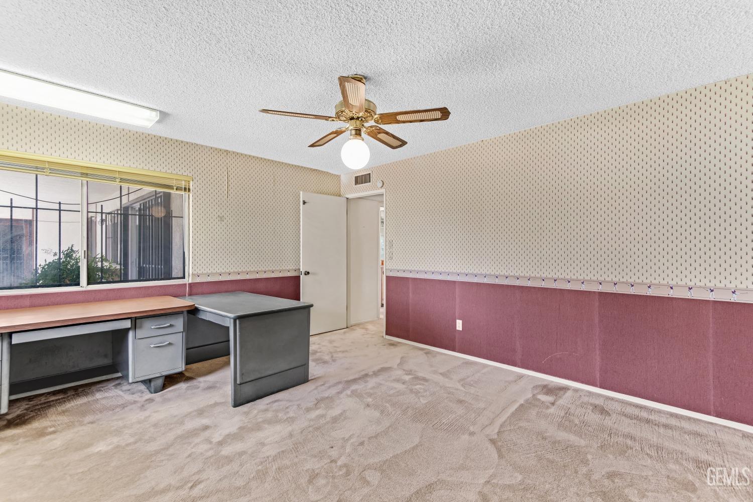 Undisclosed Address Bakersfield, CA 93309 - Photo 30 of 46 a view of workspace with furniture and window