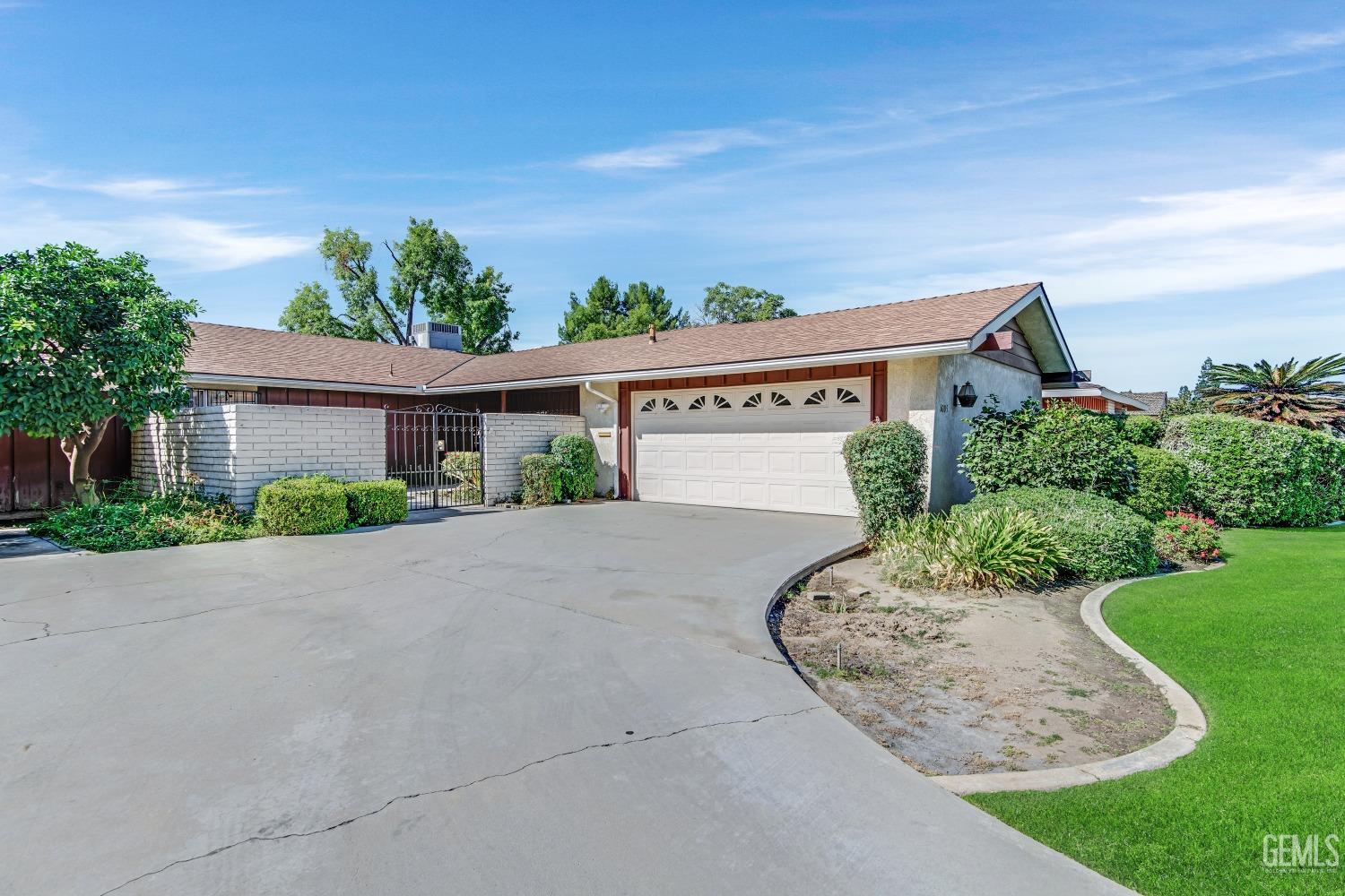 Undisclosed Address Bakersfield, CA 93309 - Photo 3 of 46 front view of a house with a yard