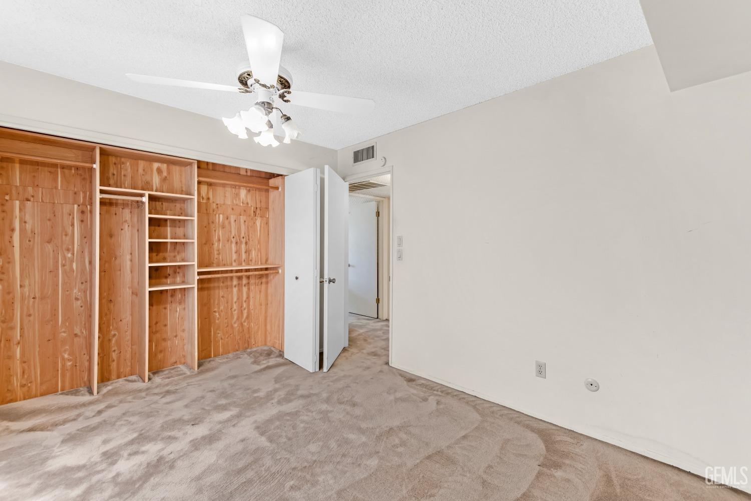 Undisclosed Address Bakersfield, CA 93309 - Photo 32 of 46 a view of empty room with a ceiling fan