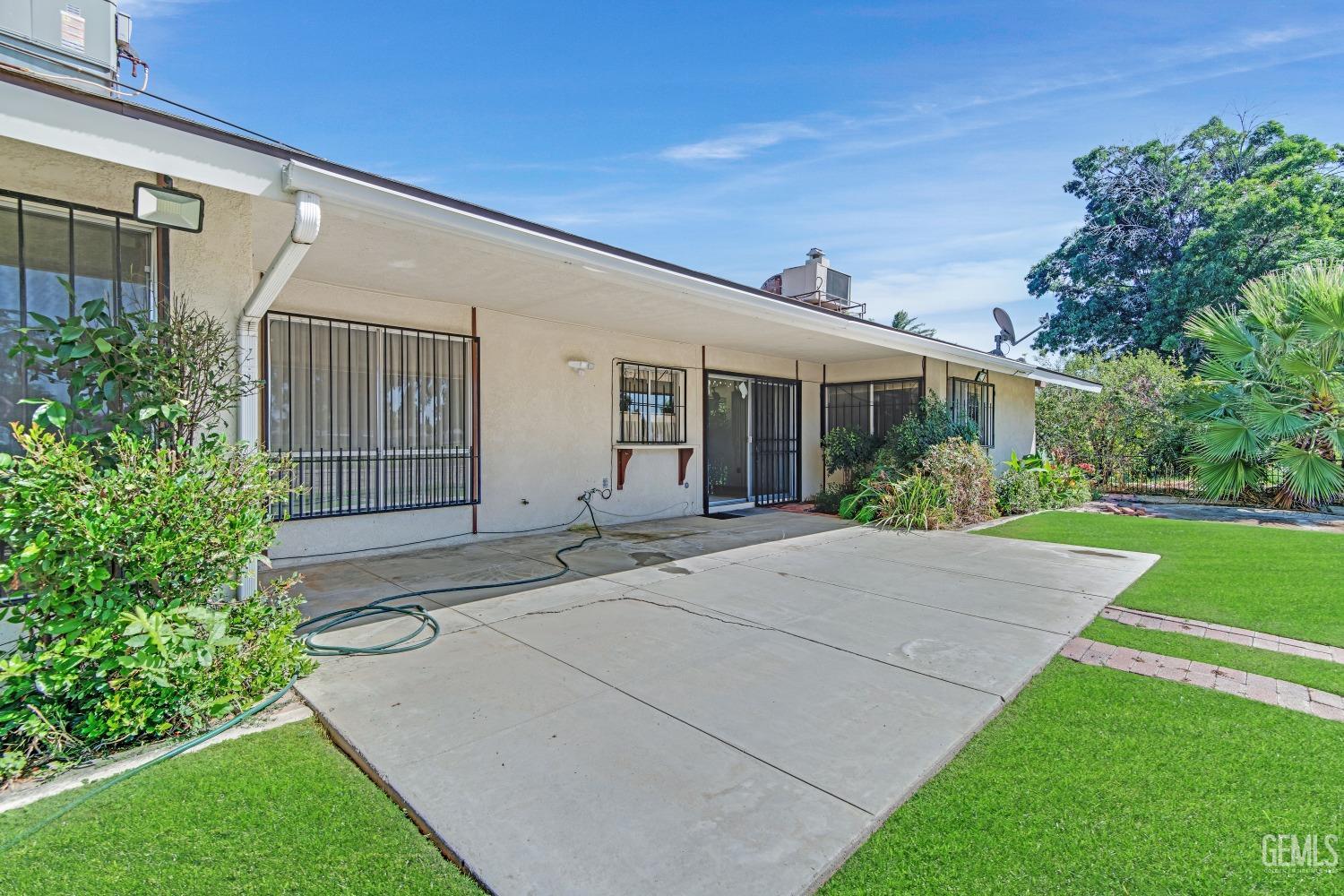 Undisclosed Address Bakersfield, CA 93309 - Photo 33 of 46 a house with garden in front of it