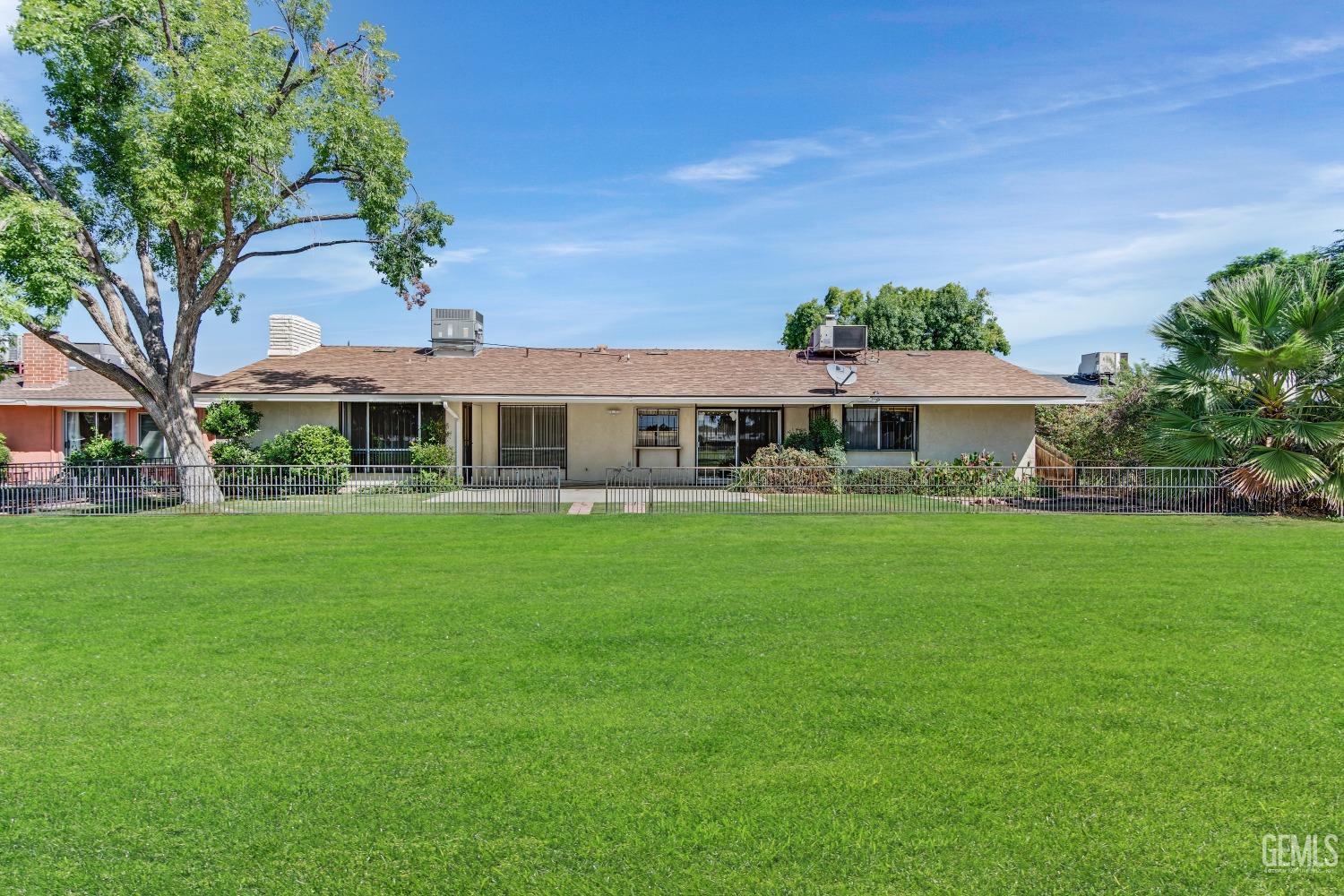 Undisclosed Address Bakersfield, CA 93309 - Photo 40 of 46 a front view of a house with a yard
