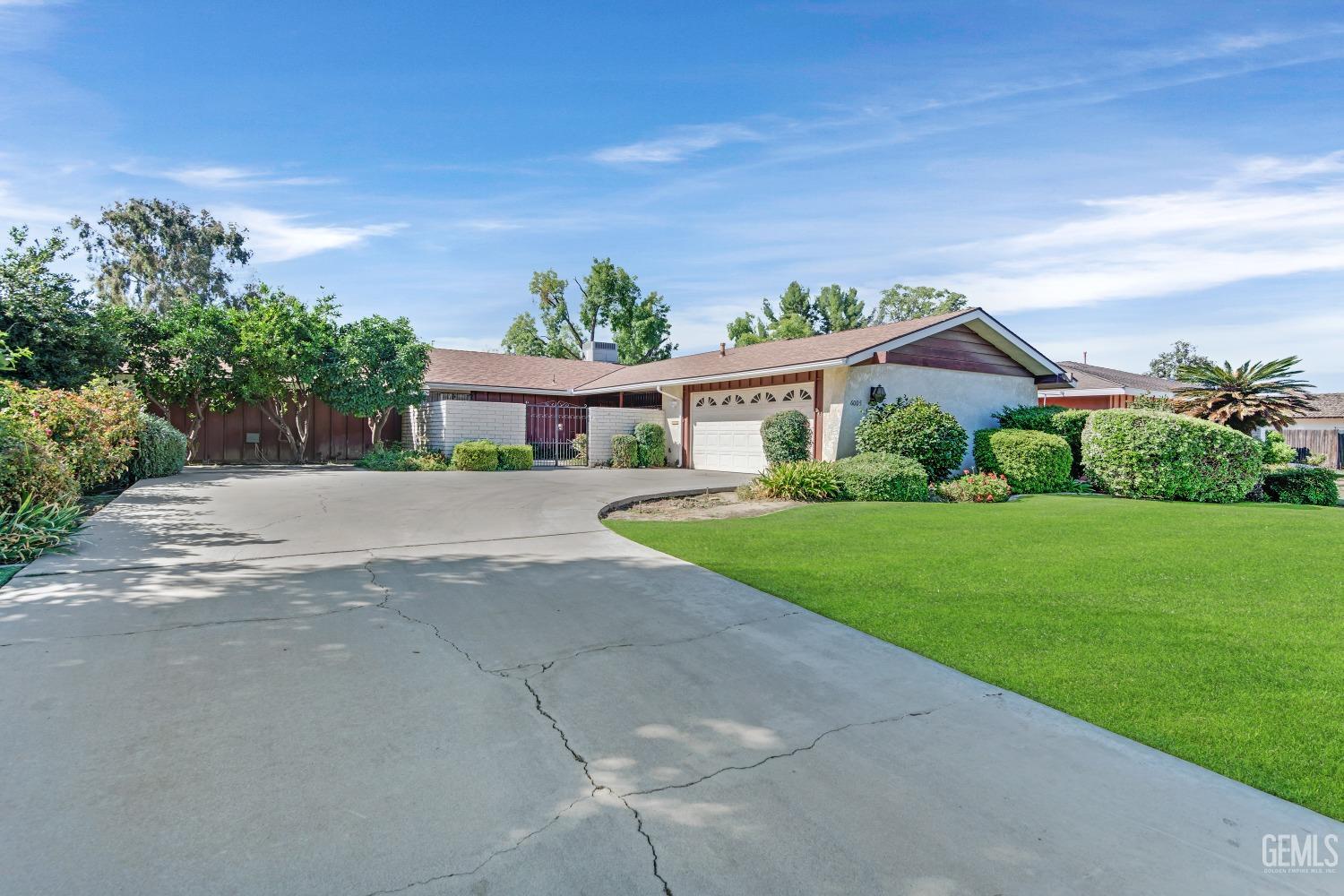 Undisclosed Address Bakersfield, CA 93309 - Photo 41 of 46 a front view of a house with a yard