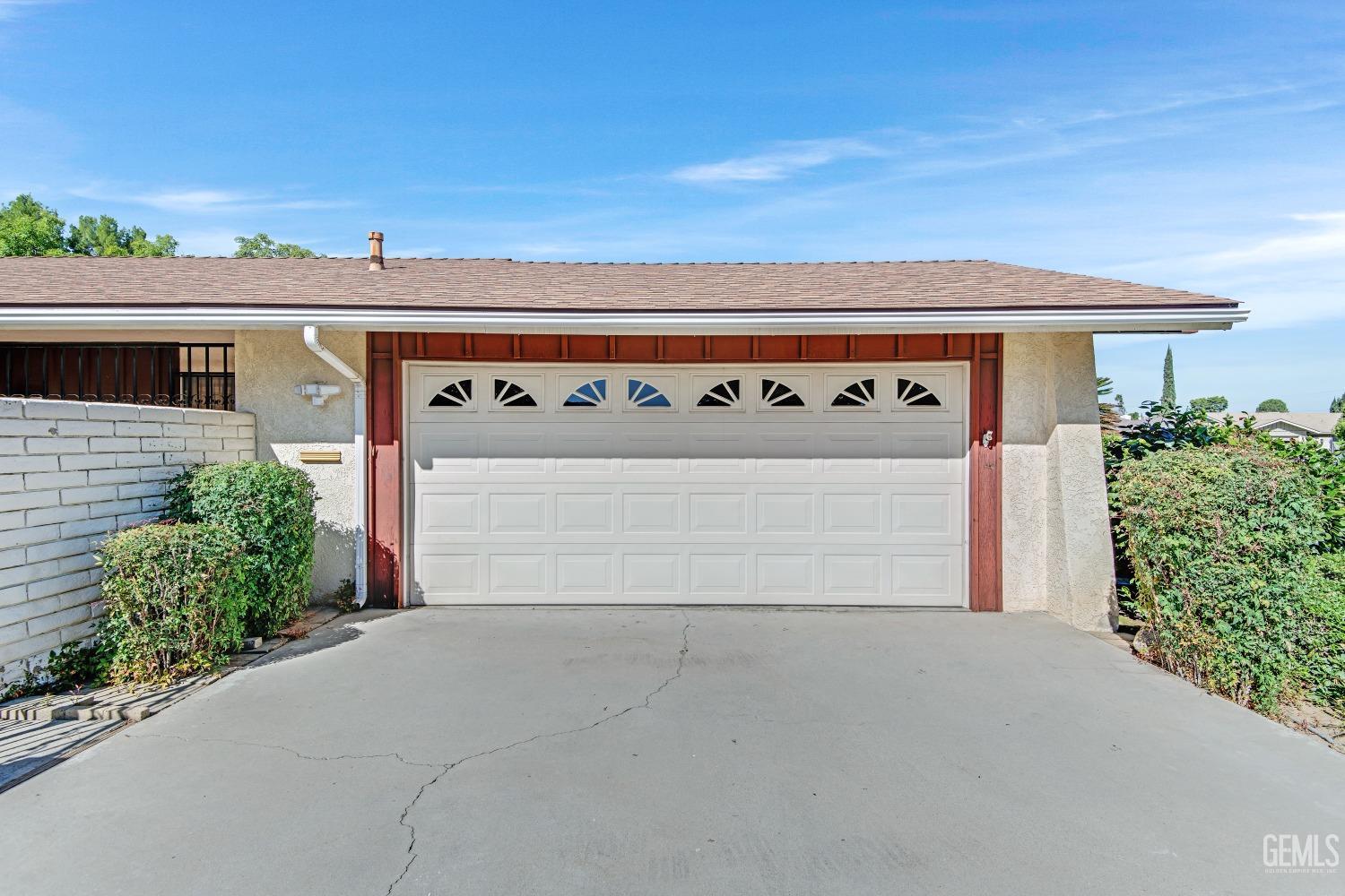 Undisclosed Address Bakersfield, CA 93309 - Photo 42 of 46 front view of a house with a garage