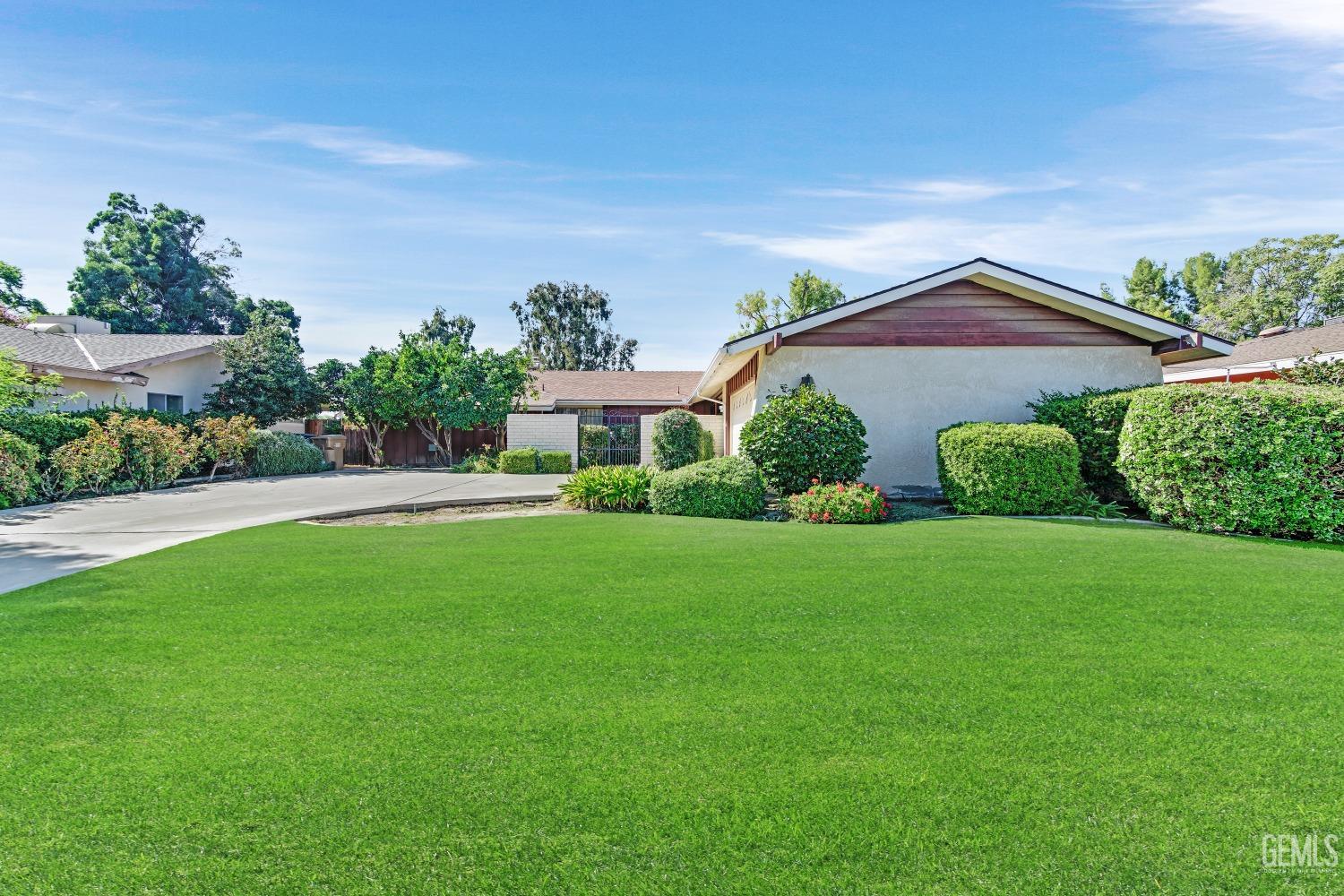 Undisclosed Address Bakersfield, CA 93309 - Photo 44 of 46 a front view of a house with a yard