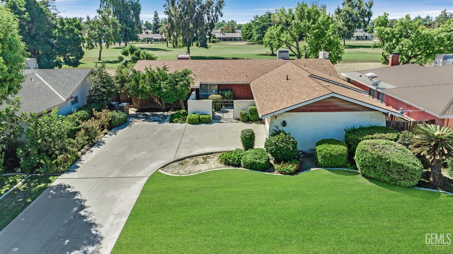 Undisclosed Address Bakersfield, CA 93309 - Photo 46 of 46 an aerial view of a house with garden