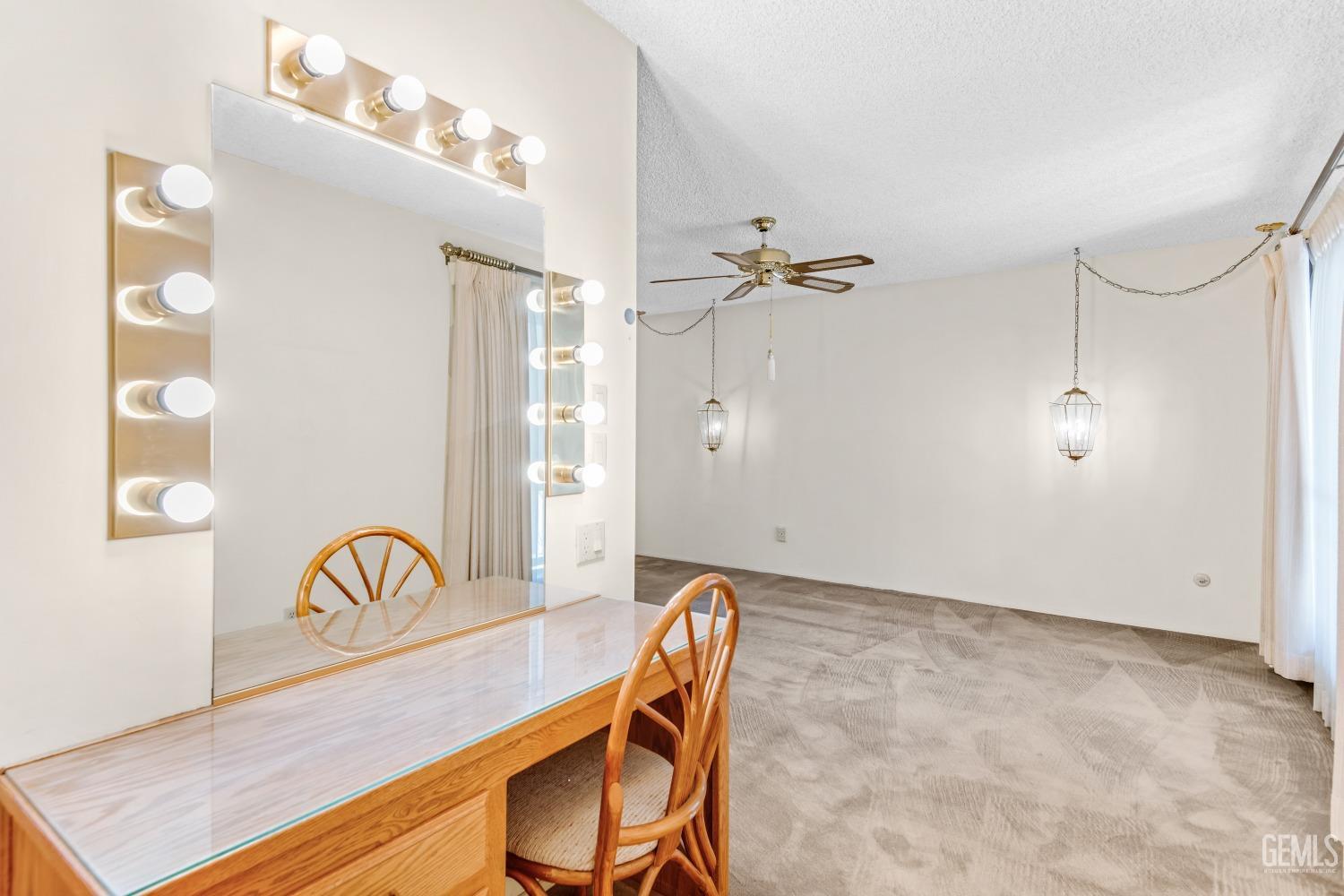 Undisclosed Address Bakersfield, CA 93309 - Photo 10 of 46 a view of a dining room with furniture and a chandelier