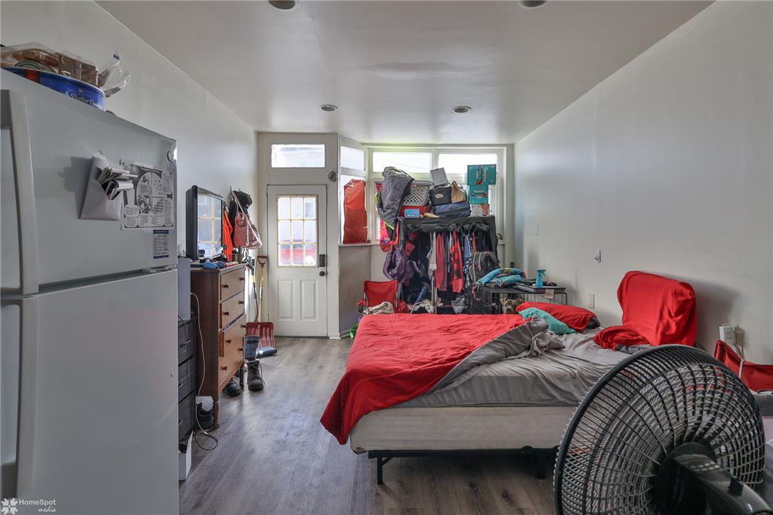 115 East Ruddle Street Coaldale, PA 18218 - Photo 8 of 57 A long bedroom features recessed lighting and smooth flooring leading to a private outdoor exit.