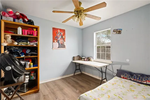 a bedroom with bed and a window