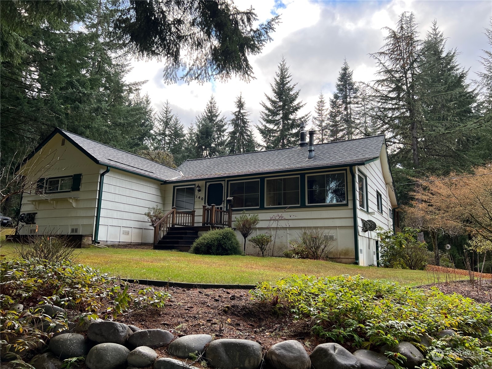 140 Frogner Road Chehalis, WA 98532 - Photo 1 of 1 a front view of house with yard and trees in the background