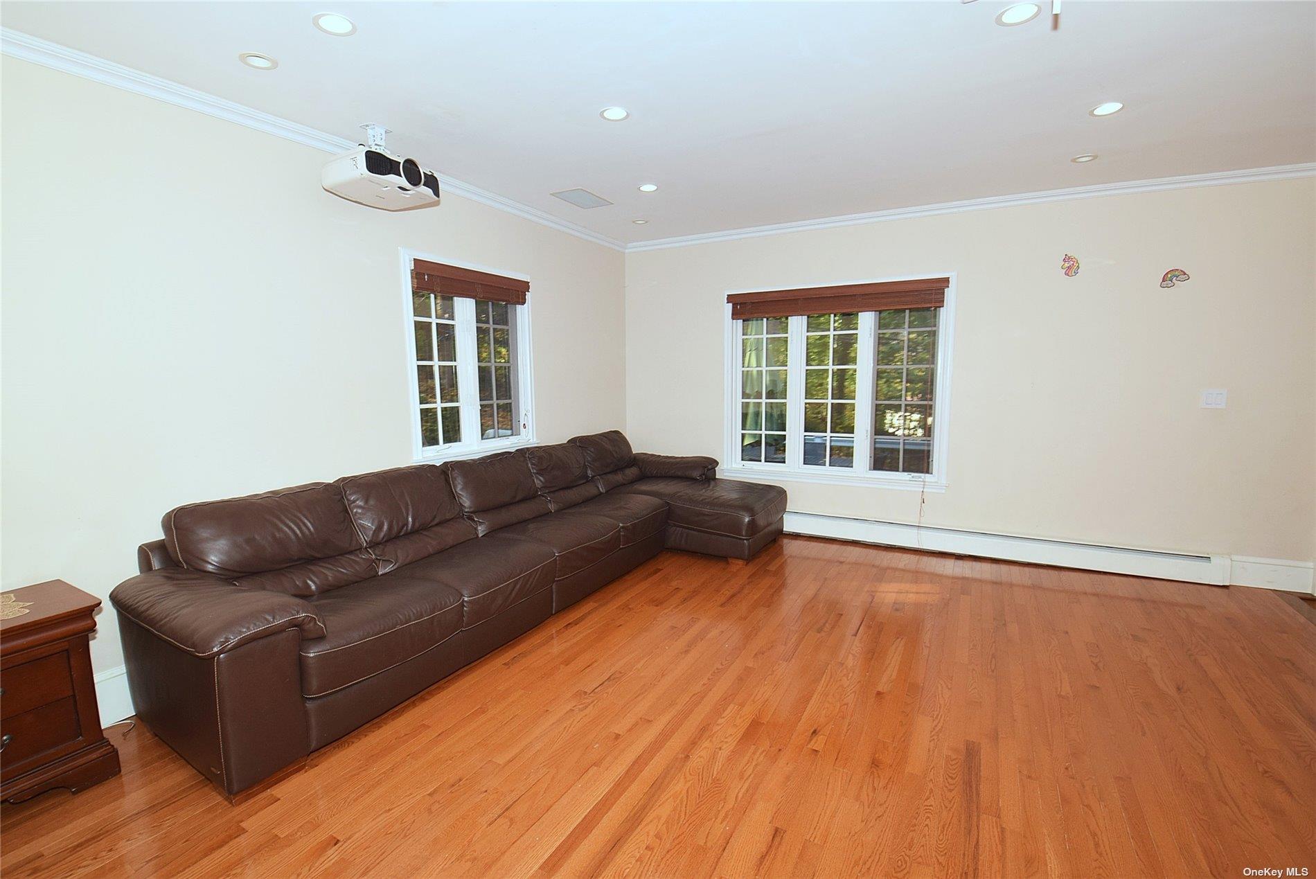 539 Manhasset Woods Road Manhasset, NY 11030 - Photo 14 of 30 a living room with furniture and wooden floor